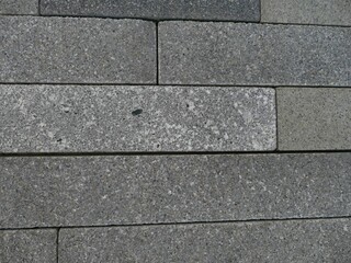 Grey concrete blocks forming a textured wall