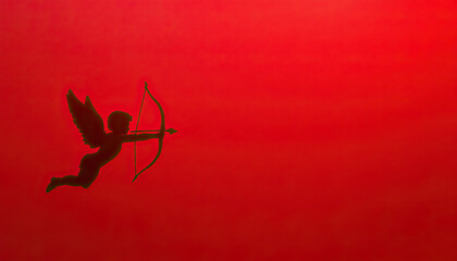Cupid silhouette aiming bow on bold red background