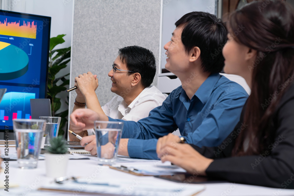 Leinwandbilder Analyst team utilizing BI Fintech to analyze financial data at table in meeting room. Businesspeople analyzing BI dashboard power for business insight and strategic marketing planning. Prudent