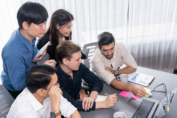 Fototapeta premium Group of diverse office worker employee working together on strategic business marketing planning in corporate office room. Positive teamwork in business workplace concept. Prudent