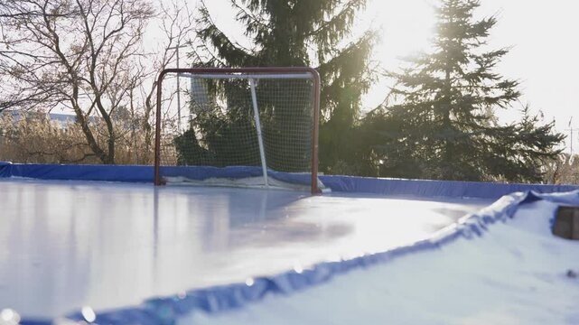 Outdoor hockey rink golden hour winter sports