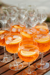 Aperol Spritz cocktails with orange slices on a summer day