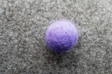 Purple Felt Ball On Gray Felt
