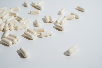 Pills close-up on a light background. Taking vitamins or medications. Concept of healthcare, medicine, pharmacy, disease prevention  
