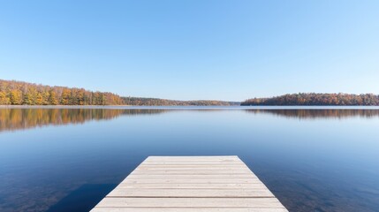 Naklejka premium Tranquil autumn lake dock reflection