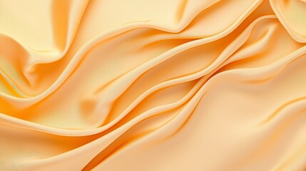 Close-up of smooth yellow silk fabric draped elegantly, showcasing its luxurious texture and shine, perfect for textile design or fashion photography.