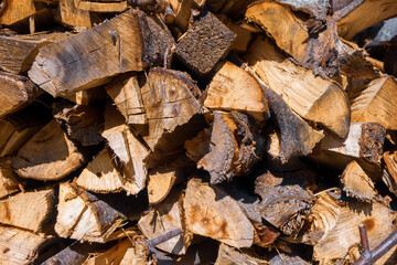 Firewood in the firewood stove creates coziness and warmth, filling the house with an atmosphere of comfort and disposing to family gatherings.