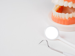 Dental tools for examination. Probes, mirrors, picks; close-up on instruments used for oral health diagnosis.