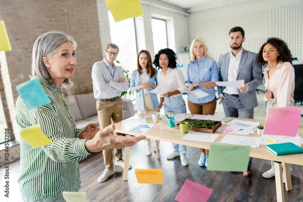 Aufkleber professional team brainstorming and collaborating in a modern office workspace with sticky notes and