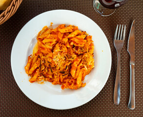 Delicious baked gratin macaroni with cheese served on plate