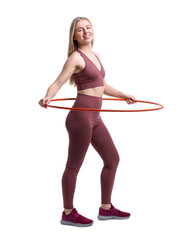 Beautiful young woman exercising with hula hoop on white background