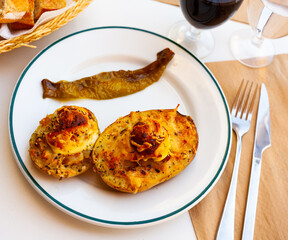 Dish with stuffed potatoes with boiled egg closeup