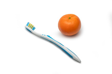 Blue Toothbrush and Fresh Orange Citrus Fruit Isolated on White Background