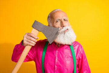Photo of bearded gentleman cut beard axe barbershop wear fashionable clothes suspenders isolated on vibrant yellow color background