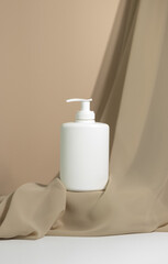 GeneratedWhite pump dispenser bottle on platform. Minimalist Modern Style product photography. Isolated Bottle of body cream with delicate fabric. Advertising Photography. Online shopping.
Minim Image