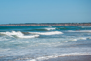 View of the beaches of Mar del Plata with the cliffs in the background on a sunny day