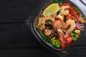 Tasty poke food with seafood and vegetables