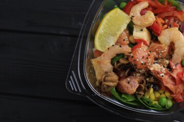 Tasty poke food with seafood and vegetables