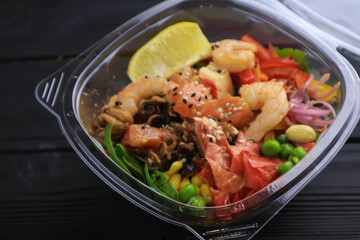 Tasty poke food with seafood and vegetables
