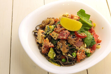 Tasty poke food with seafood and vegetables