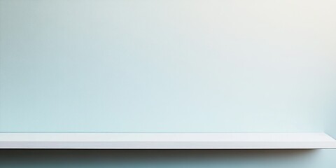Obraz premium An image showcasing a minimalist wall art display with a clean white frame against a light blue wallpaper background, reflecting modern design aesthetics.