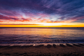 Beautiful sunrise on the Mediterranean Sea. Winter Barcelona. Spain in January.