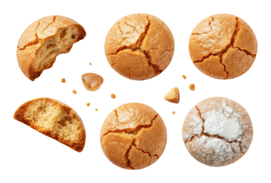 Close-up of assorted amaretti cookies on transparent background, some whole and with bites