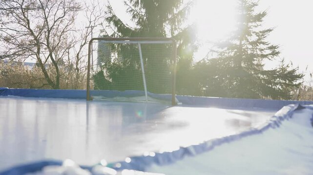 Outdoor hockey rink slow slider shot