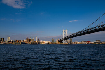 Obraz premium The architectural beauty that is the Ben Franklin Bridge spanning across the Delaware River between Camden NJ and Philadelphia Pennsylvania