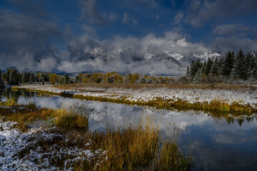 USA, Wyoming. Landscape of snow on mountains and Snake River wetland, Grand Teton National Park