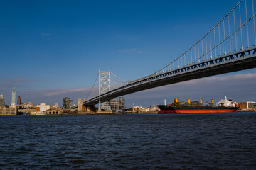 The architectural beauty that is the Ben Franklin Bridge spanning across the Delaware River between Camden NJ and Philadelphia Pennsylvania