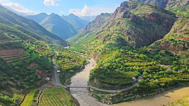 Breathtaking valley with terraced fields and winding river, a stunning nature retreat.
📍Zhivar, Hawraman Takht 