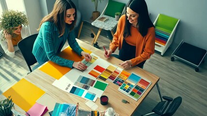 Creative team collaborating on color concept design in modern office