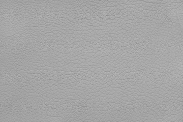 Texture of genuine leather or artificial synthetic leatherette pastel gray color. Skin structure close up, macro, Background, wallpaper, backdrop with copy space.