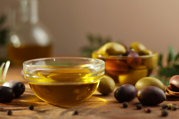 A premium olive oil with olives and fresh leaves, top view 