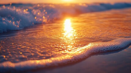 Sunset on tropical beach, close-up of golden sun reflecting on the ocean