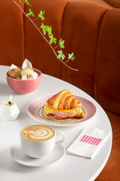 Breakfast table, Croissant and Coffee served on a restaurant table