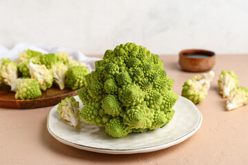 Plate with romanesco cabbage on beige table