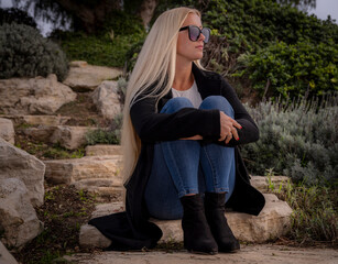 Blonde model in countryside landscape setting models Southern California Winter fashion