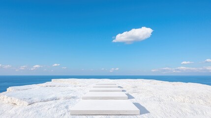 White steps leading to ocean under blue sky; peaceful scene, ideal for meditation or success imagery