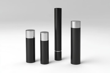 Obraz premium Four black bottles with silver tops