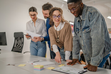 multicultural colleagues work together on the new project at office