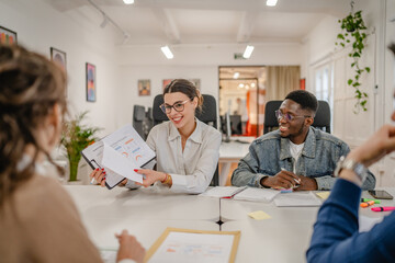 two multicultural colleagues male and female at business meeting