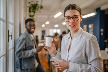 Portrait of beautiful businesswoman drink coffee in the office