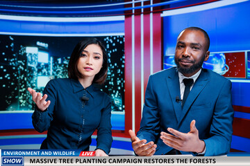 Nature preservation campaign on live tv discussed by reporters team, reading headlines about...