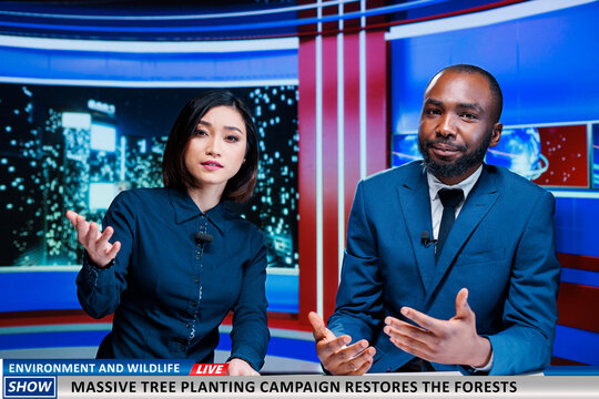 Nature preservation campaign on live tv discussed by reporters team, reading headlines about planting trees to protect the environment. Team presenting news about saving forests program.