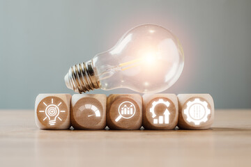 Creative representation of Six Sigma with light bulb and gear icons symbolizing quality management...