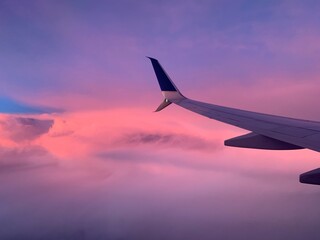 airplane in the sky at sunset