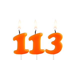 Orange birthday candle on white background - Number 113