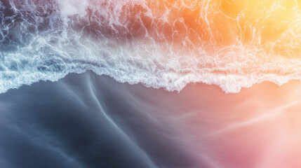 Fototapeta premium Colliding ocean waves create stunning patterns at sunset along the coastline